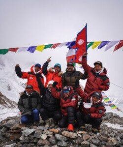 Nirmal "Nims" Purja, Dawa Tenji Sherpa (team MG), Mingma G, Dawa Temba Sherpa and Pem Chiri Sherpa, Mingma David Sherpa, Mingma Tenzi Sherpa, Nimsdai Purja and Gelje Sherpa are seen before the winter attack on K2, Pakistan, Jan. 5, 2021.