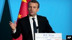 French President Emmanuel Macron delivers a speech at the Daming Palace in Xi'an in northwestern China's Shaanxi province, Monday, Jan. 8, 2018.