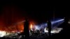 Firefighters make a stand in the backyard of a home in front of the advancing CZU August Lightning Complex Fire on Aug. 21, 2020, in Boulder Creek, Calif. 
