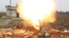 FILE - Free Syrian Army fighter fires a shell toward Islamic State fighters in the northern Aleppo countryside, Syria. U.S. Secretary of Defense Ash Carter said Friday that "sharing and fusing" information across the battlefield is helping restrict foreign fighters' movements.