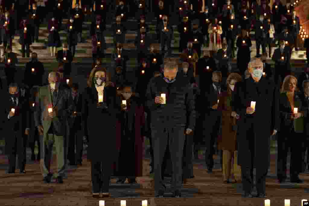 Bipartisan members of the House and Senate hold a moment of silence for 500,000 U.S. COVID-19 deaths, Feb. 23, 2021, on the east front steps of the Capitol in Washington.