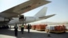 Airport workers load the first cargo plane after the Afghanistan-India air corridor inauguration ceremony at Hamid Karzai International Airport in Kabul, Afghanistan, June 19, 2017.