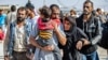 A man, suspected of having collaborated with the Islamic State group, is released from a Kurdish-run prison, Oct. 15, 2020, in Qamishli, Syria. An estimated 1,000 Kazakhs traveled to Syria at the peak of the country’s civil war in 2012 to join IS.