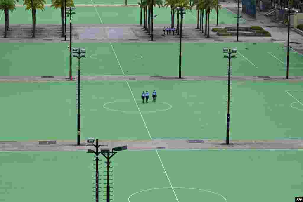 Police patrol at Victoria Park in the Causeway Bay district of Hong Kong, after closing the venue where Hong Kong people traditionally gather annually to mourn the victims of China&#39;s Tiananmen Square crackdown in 1989.