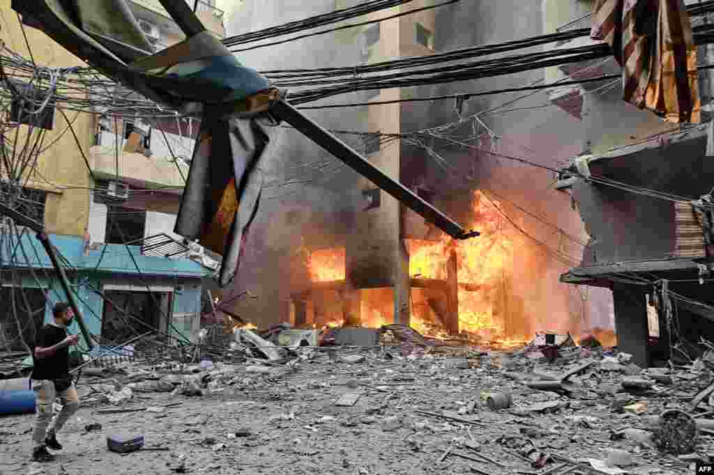A fire rages inside a building hit by an Israeli airstrike that targeted the neighborhood of Haret Hreik in Beirut&#39;s southern suburbs, Lebanon.