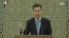 An image grab taken from the state-run Syrian news channel shows on July 16, 2014 Syrian President Bashar al-Assad delivering a speech during a swearing-in ceremony at the presidential palace in Damascus. 