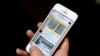 FILE - An Iranian man shows Telegram app messages on his mobile phone in Tehran, Feb. 24, 2016. 