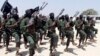 FILE - Newly trained al-Shabab fighters participate in military exercises in the Lafofe area, south of Mogadishu, in Somalia, Feb. 17, 2011. 