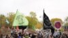 Climate activists march through the streets of Glasgow, Scotland, Friday, Nov. 5, 2021 which is the host city of the COP26 U.N. Climate Summit. The protest was taking place as leaders and activists from around the world were gathering in Scotland's bigges