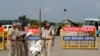 Indian policemen stand guard at a temporary road blockade near Sunaria Jail where Dera Sacha Sauda sect chief Gurmeet Ram Rahim Singh is lodged in Rohtak, some 80 kilometres (50 miles) from New Delhi, Aug. 28, 2017. 