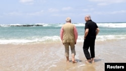 Israel's Prime Minister Benjamin Netanyahu (R) walks with India's Prime Minister Narendra Modi as they visit Olga Beach and a water desalination unit operated by G.A.L. Water Technologies, near Hadera, Israel, July 6, 2017.