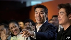 Thailand's Future Forward Party leader Thanathorn Juangroongruangkit, center, talks to reporters during a press conference at the party's headquarters in Bangkok, Jan. 21, 2020.