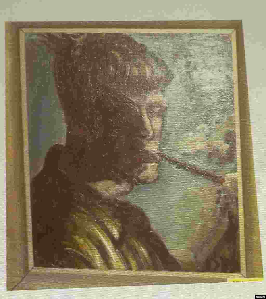 A newly discovered self-portrait of the German painter Otto Dix is beamed onto a wall during a news conference about works of art found in a Munich apartment in 2011.