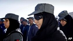 Afghan policewomen attend their graduation ceremony in Herat, west of Kabul, Afghanistan, Dec. 20, 2012.