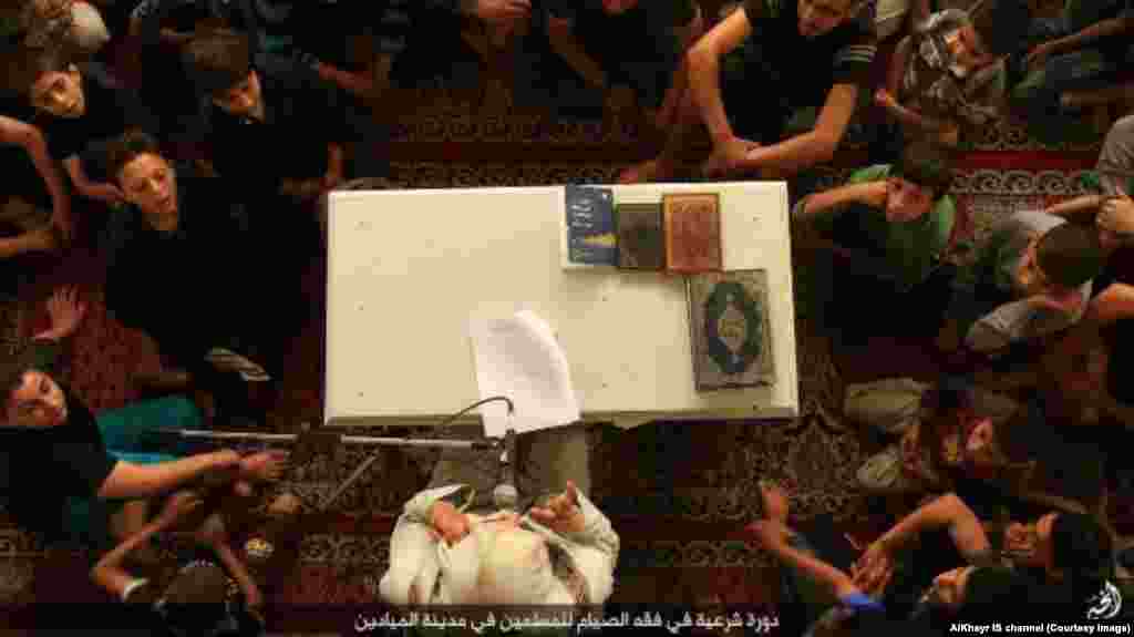 Young boys receive lessons in the Quran during Ramadan.