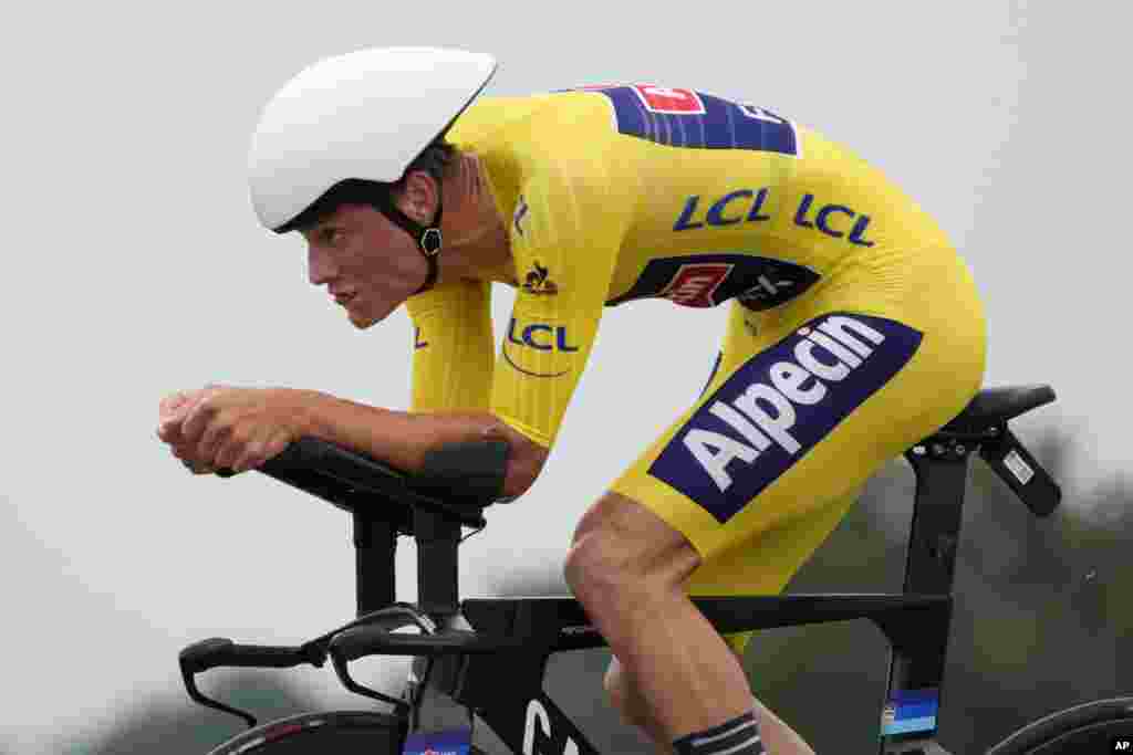 Netherland&#39;s Mathieu Van Der Poel, wearing the overall leader&#39;s yellow jersey, competes during the fifth stage of the Tour de France cycling race, an individual time-trial over 27.2 kilometers (16.9 miles) with start in Change and finish in Laval Espace Mayenne, France.