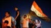 Pendukung gerakan Sadr Irak merayakan kemenangan mereka setelah hasil awal pemilihan parlemen Irak diumumkan di Baghdad, Irak 11 Oktober 2021. (REUTERS/Thaier Al-Sudani)
